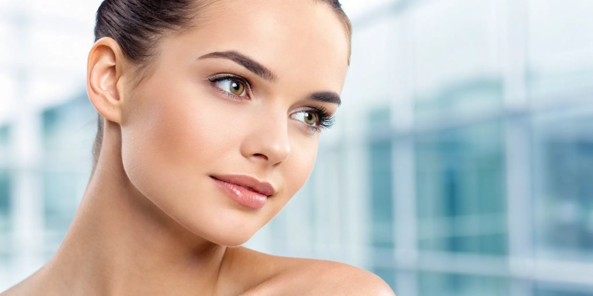 Woman with glowing skin from a professional skin rejuvenation treatment in Grand Blanc.